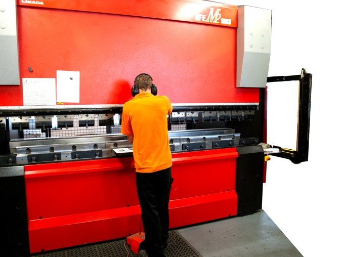 One of our skilled CNC press-brake engineers using Amada equipment