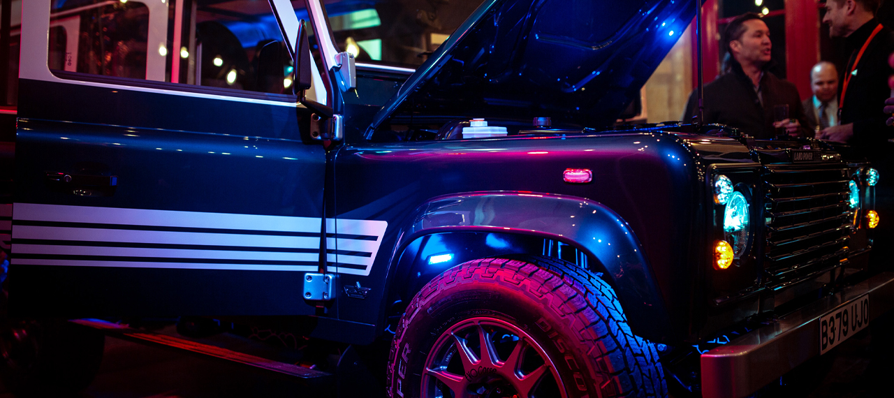 Revived-land-rover-in-spotlights-on-stage